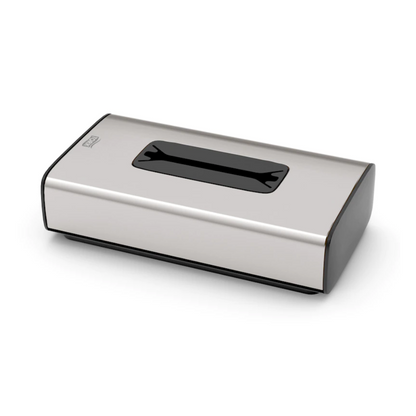 Der Tork 460013 Spender für Kosmetiktücher aus der Image Line F1-Kollektion von TORK – Essity Professional Hygiene Germany GmbH ist eine Tissue-Box aus Edelstahl mit einem rechteckigen Schlitz an der Oberseite. Er präsentiert sich im Edelstahl-Design, hat schwarz lackierte Kanten und einen minimalistischen Stil, der sich ideal für die Einzelblattentnahme eignet.