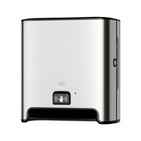 A TORK Tork Matic® 460001 Image Line stainless steel wall-mounted sensor dispenser for roll towels with H1 sensor | Package (1 piece) with black base and sensor indicator symbol on the front. Designed for touchless single-sheet dispensing, this dispenser features a modern, minimalist design and uses roll towels to ensure a hygienic experience.
