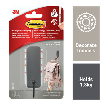 Der mittelgroße Command™ mattschwarze Haken von 3M Deutschland GmbH (17034B) hält bis zu 1,3 kg, eignet sich für die Verwendung in Innenräumen und lässt sich dank der enthaltenen 2 Strips rückstandslos entfernen - ideal zum Bohren ohne Schäden.