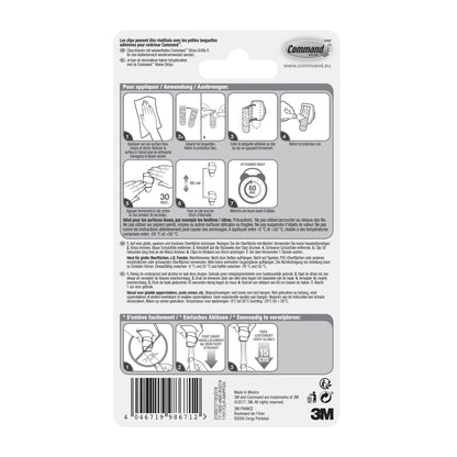 Auf der Rückseite der Command™ Outdoor Lichter-Clips, 17017CLR-AWPU (8 Clips + 10 Streifen) von 3M Deutschland GmbH befinden sich französische Anweisungen und Diagramme zum sicheren Anbringen und Entfernen, ideal für die Außenbeleuchtung mit wetterbeständigen Clips.